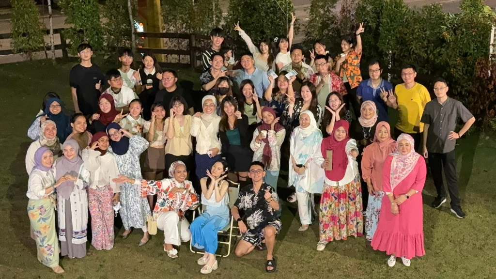 Boss Boleh team celebrating together outdoors
